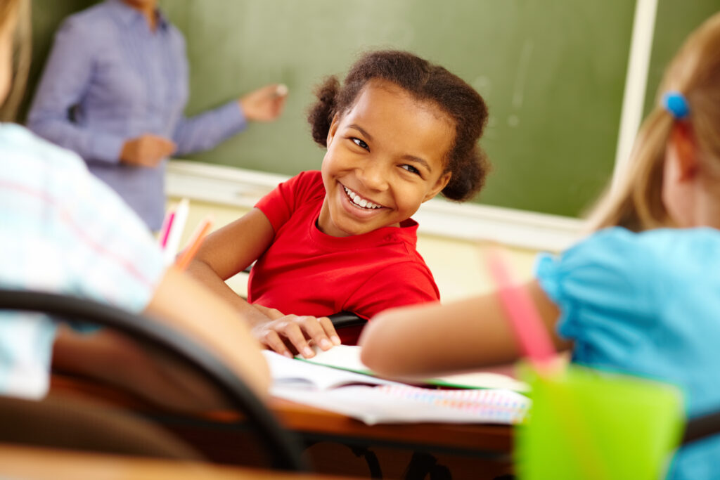 young student smiling in class