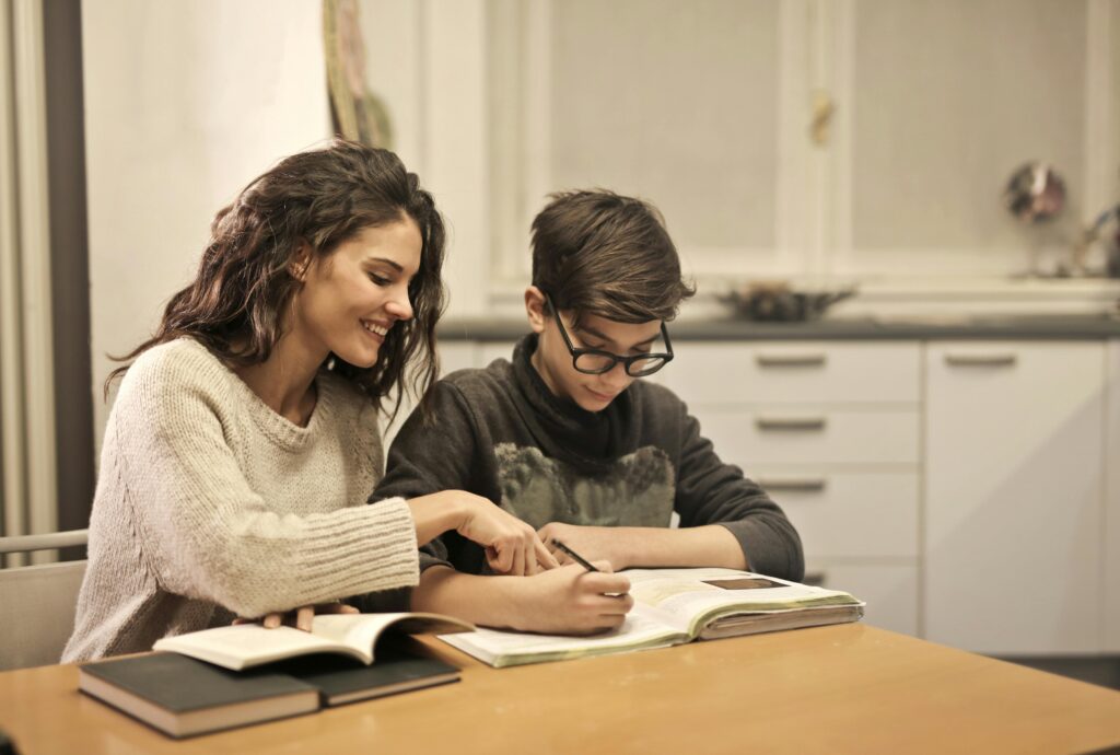 mother and son doing homework together